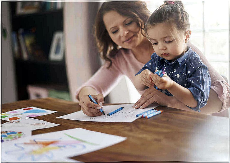 mother and girl drawing