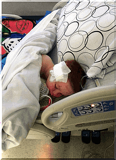 child lying in hospital