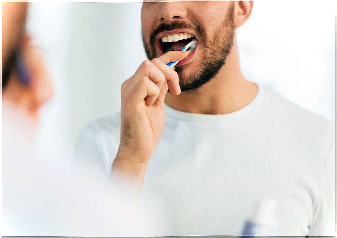 a man brushing his teeth