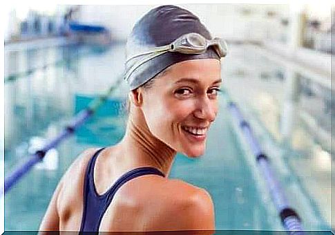 The woman has a swimming cap.